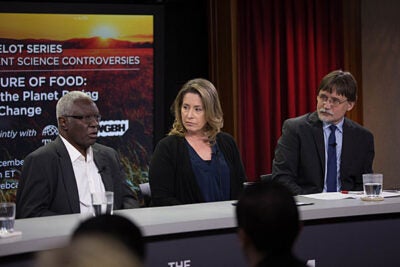 Harvard Professor Calestous Juma (from left), Margaret Walsh, senior ecologist, Climate Change Program Office, U.S. Department of Agriculture; and Harvard Chan School's Gary Adamkiewicz, discuss the effects climate change will have on food security in the U.S. and Africa.