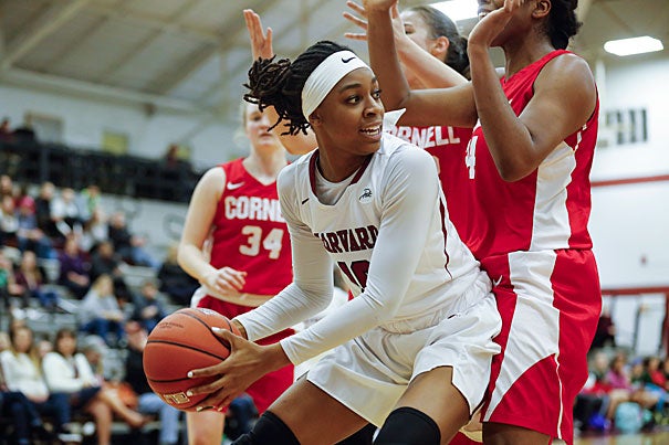 Destiny Nunley ’17 looks to pass beneath the basket on the way to a 62–59 Crimson victory over Cornell. 

