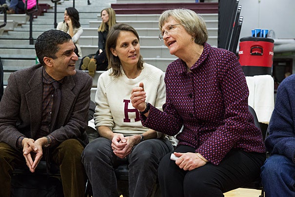 Women's basketball v. Cornell. Harvard won, 62-59. President Drew Gilpen Faust , right, was joined by Danoff Dean of Harvard College and Faculty Dean of Cabot House Rakesh Khurana, left, and his wife, Faculty Dean of Cabot House Stephanie Khurana on the Harvard bench as honorary coaches for the game. Jon Chase/Harvard Staff Photographer