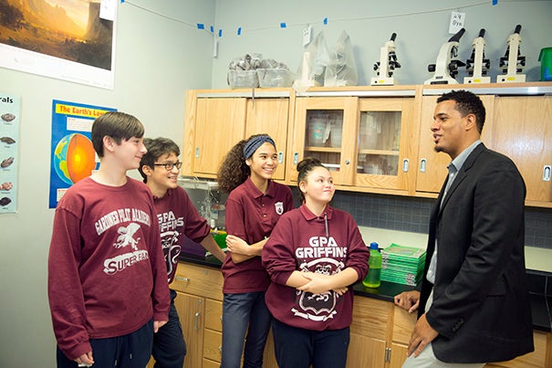 Artur Shehu, (from left) Gerardo Umaru, Illyanis Santiago, and Victoria Coll, all GPA students, enjoy their new science classroom with their teacher Marcus Penny. Harvard donated money for the science classroom at the Gardner Pilot Academy. Kris Snibbe/Harvard Staff Photographer