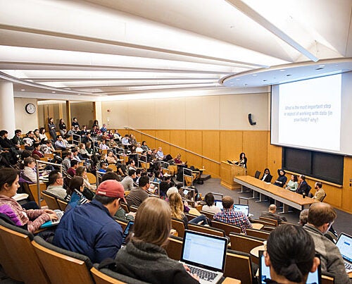 Students and researchers listen to a discussion on the challenges of working with big data at the Data Concepts Panel during Harvard DataFest.