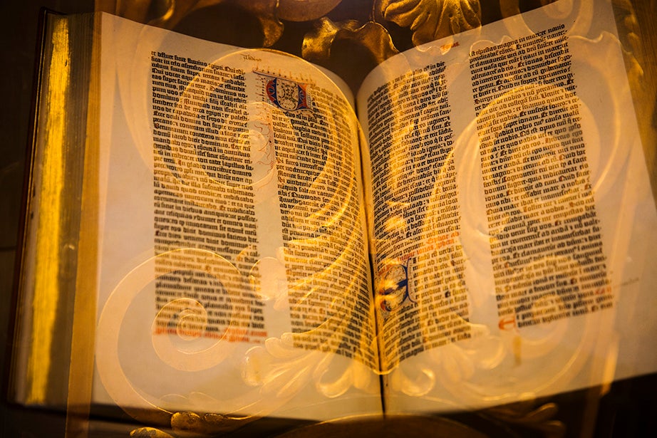 Ornate gilding enhances pages of the Gutenberg Bible on display in the Harry Elkins Widener Memorial Library.