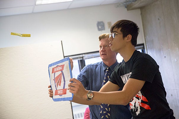 Albert Chien '19 (right) flies paper planes with John Collins, world record holder for flight distance of a paper airplane, during Collins' workshop that uses the surprisingly precise strategy of paper airplane folding to teach design engineering. 