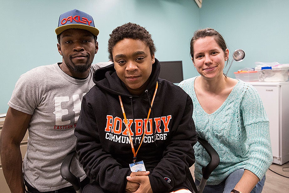 Guests Dorell B. (from left) and Janet B. pose with fifth-year Graduate School of Arts and Sciences student Sam Wellington. Dorell is hoping to enroll at Bunker Hill Community College. Janet is studying to be a veterinarian at Roxbury Community College. Both appreciate the help Y2Y gives them with housing and job issues, as well as the stress-free environment there. Sam studies tuberculosis and will be getting her Ph.D. in chemical biology this spring. She volunteers for nearly 30 hours a week, and appreciates the people focus at Y2Y, so different from her lab work. 