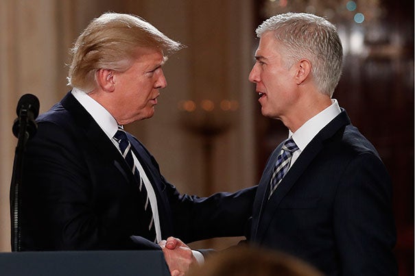 President Donald Trump shakes hands with 10th U.S. Circuit Court of Appeals Judge Neil Gorsuch, J.D. '91, his nominee for Supreme Court Justice.