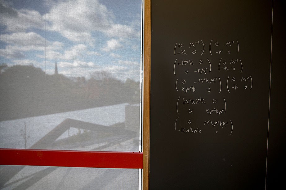A math lounge blackboard sports writing dealing with a discrete dynamical system, part of linear algebra.