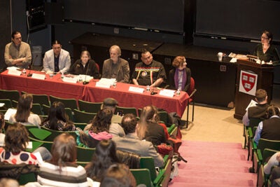 A panel discussed the Dakota Access Pipeline under land owned by the Standing Rock Sioux, explaining their opposition and lessons learned during their protests.
Among the panelists: Nick Estes (from left) of the Lower Brule Sioux Tribe (LBST); Chase Iron Eyes of the Lakota/Standing Rock Sioux Tribe; Jace Cuney DeCory of the Lakota/Cheyenne River Sioux Tribe; Jeffrey Ostler, professor at the University of Oregon; Lewis Grass Rope of the LBST; Harvard Professor Lisa McGirr. Speaking is Shelly Lowe, executive director of the Harvard University Native American Program.