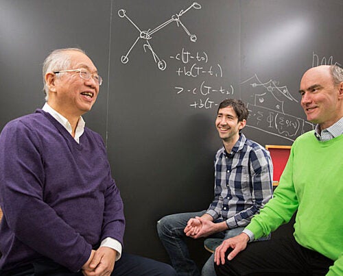 Shing-Tung Yau (from left), William Caspar Graustein Professor of Mathematics, Ben Allen, researcher at the Program for Evolutionary Dynamics (PED), and Martin Nowak, PED director, are co-authors of a new study that examines how cooperation emerges in social networks and debuts an algorithm that can calculate the likelihood that a network will foster cooperation.