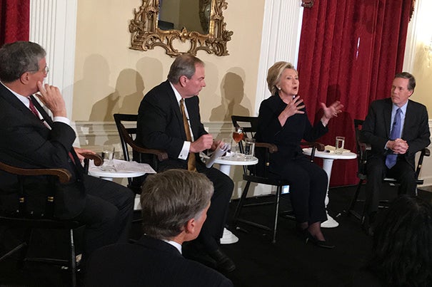 Hillary Clinton answers questions from faculty and students at a luncheon in Loeb House, with Professors Robert Mnookin (from left), James Sebenius, and Nicholas Burns joining her.