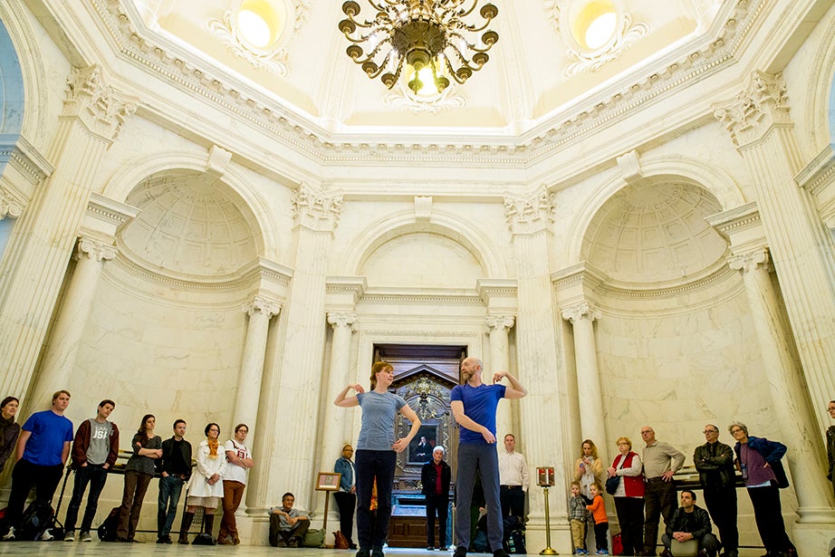 Under the creamy-colored columns and ornate arches of the Widener Library Rotunda, Christopher Roman and Jill Johnson silently present “Catalogue (First Edition),” created by and with William Forsythe, their choreographer, teacher, mentor, and friend. Rose Lincoln/Harvard Staff Photographer