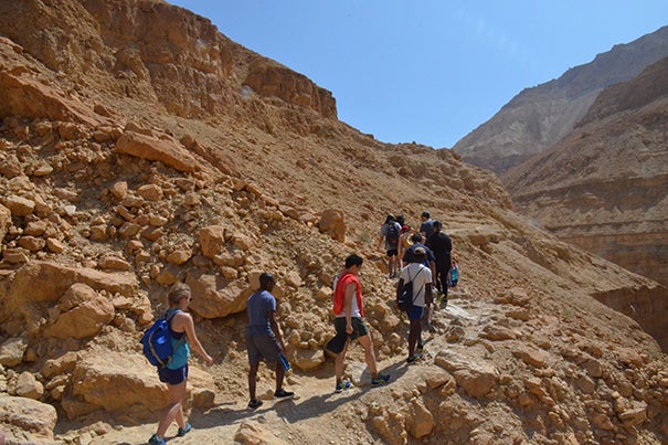 Harvard students trek up the rocky hillside along the banks of the Nahal Arugot (Nahal River). The hike can take up to four hours. 