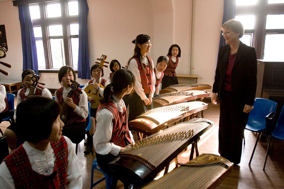 On a trip to China, President Faust visits with students at the Shanghai No. 3 Girls High School. Faust has visited with a number of secondary schools in the U.S. and abroad to reinforce the importance of higher education. Kris Snibbe/Harvard Staff Photographer
