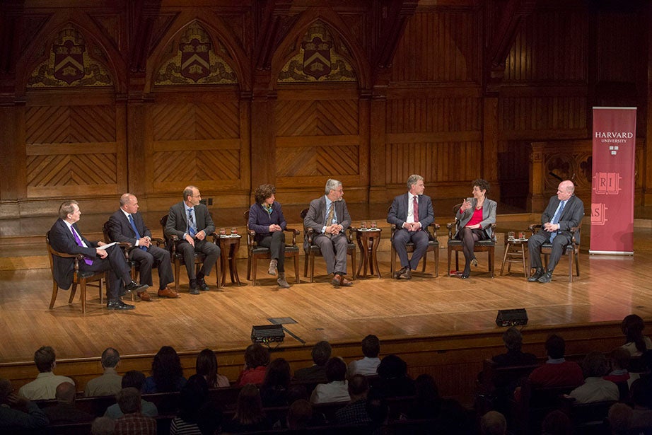 At Sanders Theatre, Charlie Rose (from left) moderates a climate change panel in 2015 with Joseph Aldy, assistant professor of public policy, Harvard Kennedy School; Christopher Field, co-chair, Working Group II of the Intergovernmental Panel on Climate Change; Rebecca Henderson, McArthur University Professor; John Holdren, assistant to the president for science and technology at the White House; Richard Newell, Gendell Professor of Energy and Environmental Economics; Naomi Oreskes, professor of the history of science; and Daniel Schrag, Sturgis Hooper Professor of Geology. As part of a University-wide focus on addressing climate change, Faust set out ambitious greenhouse-gas reduction goals for the institution in 2008, aiming to reduce its emissions, including those associated with prospective campus growth, by 30 percent—relative to its 2006 baseline—by 2016. Kris Snibbe/Harvard Staff Photographer