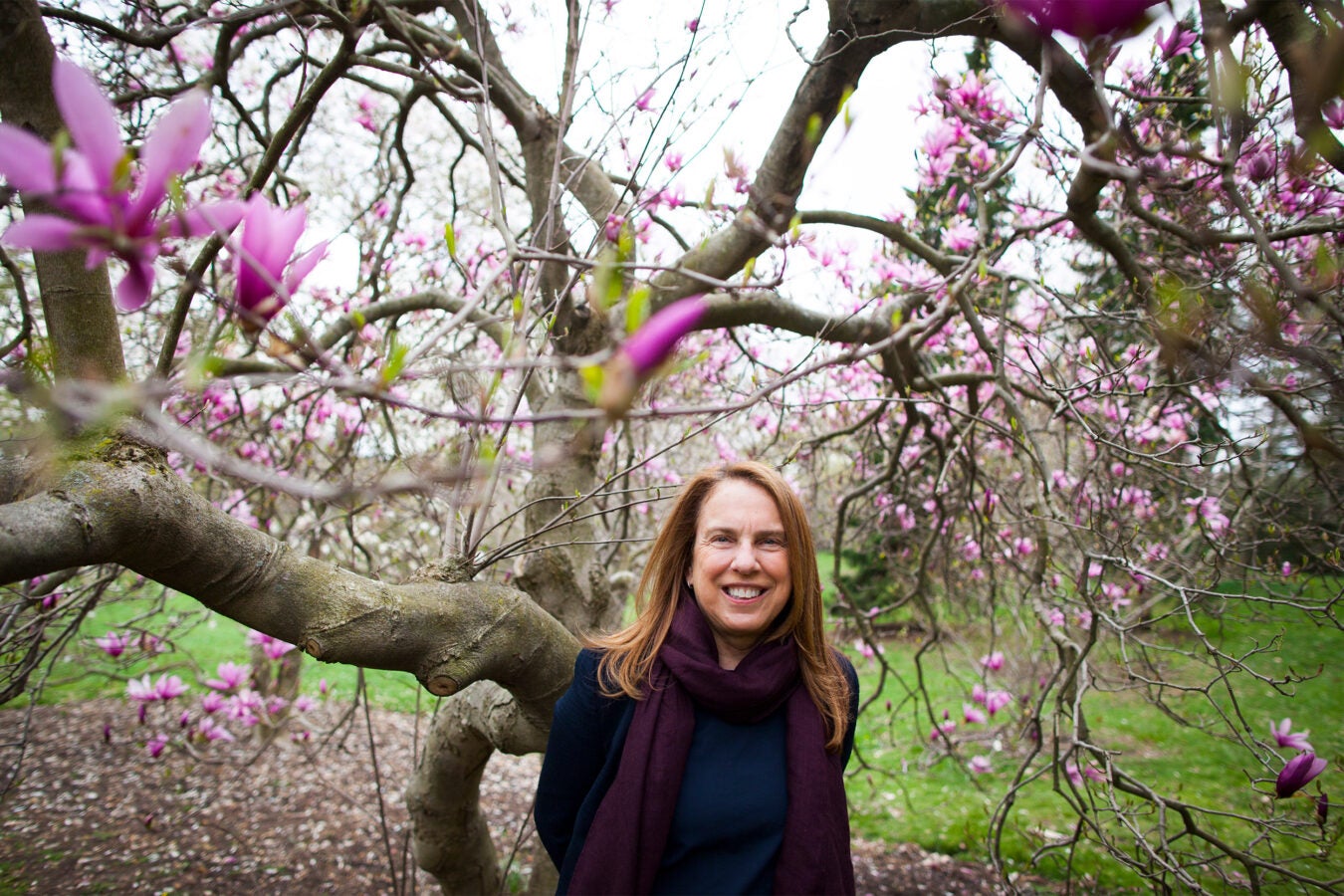 Pamela Silver by a flowering tree.