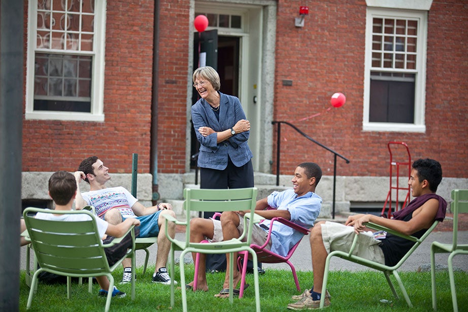 As the class of 2015 moves into Harvard Yard, President Faust speaks with students in the colorful Luxembourg Chairs. The chairs are a key component of Faust’s Common Spaces initiative, which she called “an effort to create new spaces that will draw our increasingly diverse and interdisciplinary community together and enhance the intellectual, social, and cultural life that is at the core of the Harvard experience.” Photo by Justin Ide