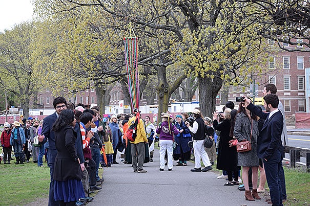 Every year in the early hours of May 1, the residents of Lowell House gather on the John Weeks Footbridge to take part in a May Day ritual to celebrate the end of the school year and relax before the start of finals.