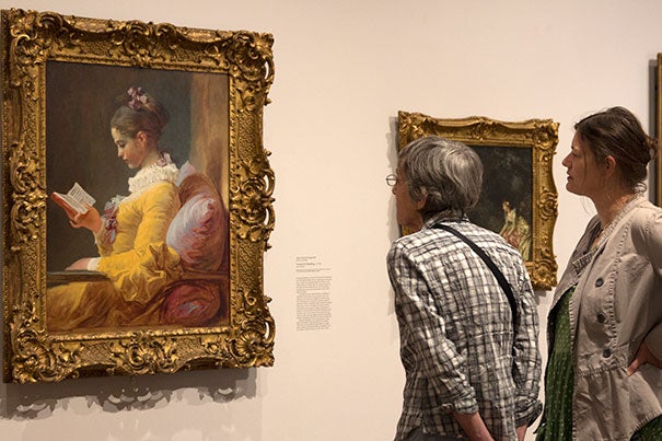 Harvard Art Museums visitors admire "Young Girl Reading" by Jean-Honoré Fragonard, a highlight of the many loans and exchanges that the museums make with other art institutions.
