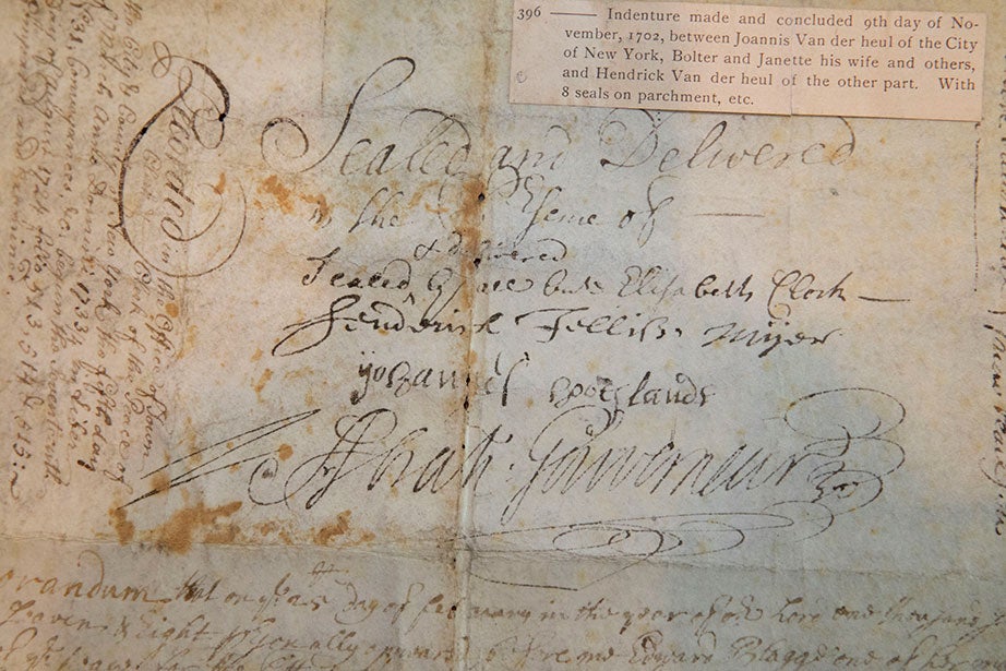 This vellum document, dated 1702, is an official record of the transfer of land on Dock Street, near the East River in New York City, to Hendrick Van der Heul. The document was “Sealed and delivered” with several signatures on one side. Harvard Law School Historical & Special Collections, Small Manuscript Collection, Small Manuscript Collection. 
