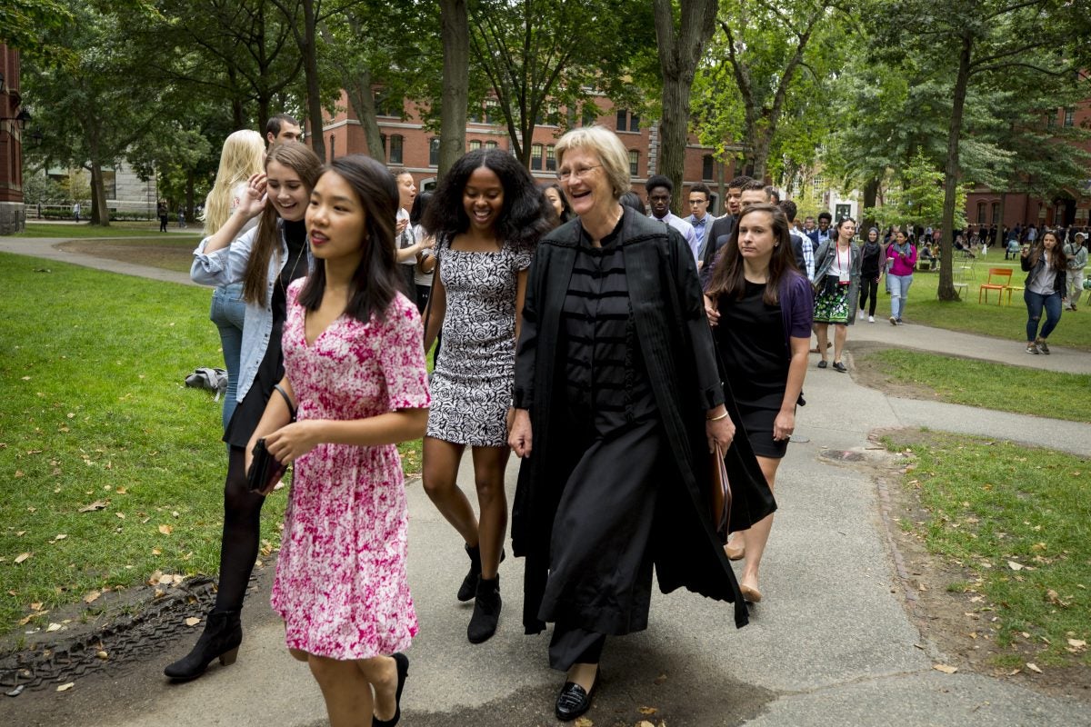 Drew Faust walking with the Class of 2021