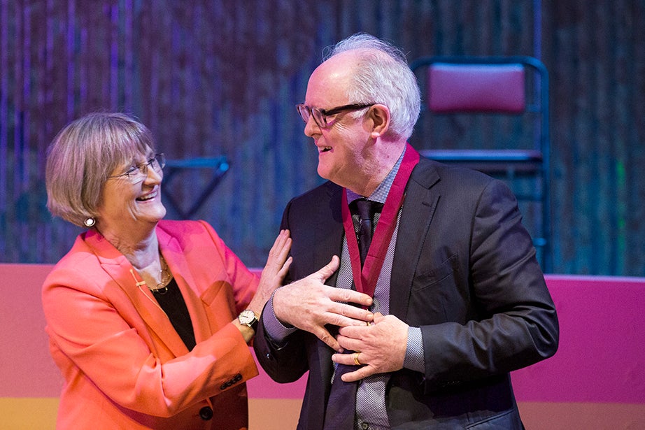 President Faust congratulates actor John Lithgow after he was awarded the 2017 Harvard Arts Medal. 