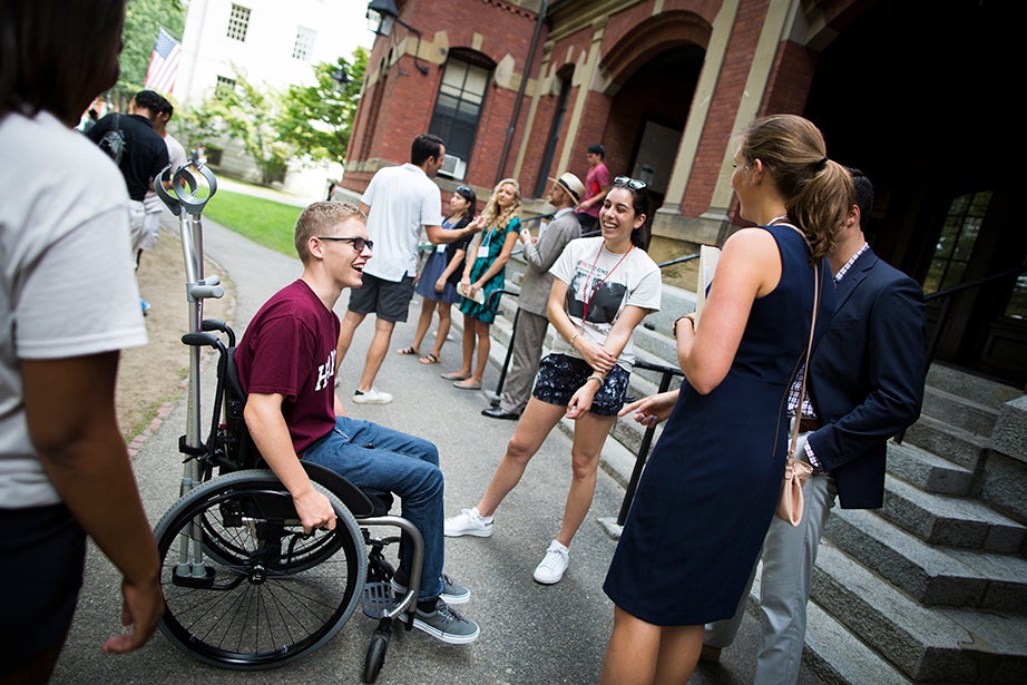 Case Mckinley ’21 (from left) meets with Nayiri Ayanian ’18, proctor Jon Rossi, and freshman adviser Rachel Brown in front of Weld Hall. Stephanie Mitchell/Harvard Staff Photographer