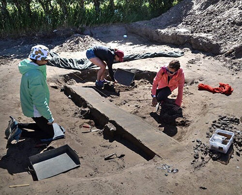 Harvard students Jessica Ding ’19 (from left), Andie Turner ’20, and Maile Sapp ’17 work at the dig site on the Danish island of Samsø as part of an immersive summer program on the Vikings