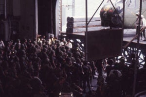 Marines aboard the USS Okinawa preparing to depart for the U.S. Embassy compound to support the evacuation of Saigon.