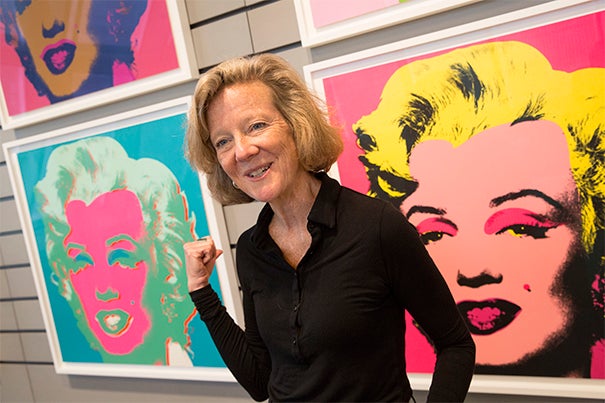 Curator Mary Schneider Enriquez with Andy Warhol silkscreen prints of Marilyn Monroe, at the Harvard Art Museums..Jon Chase/Harvard Staff Photographer.