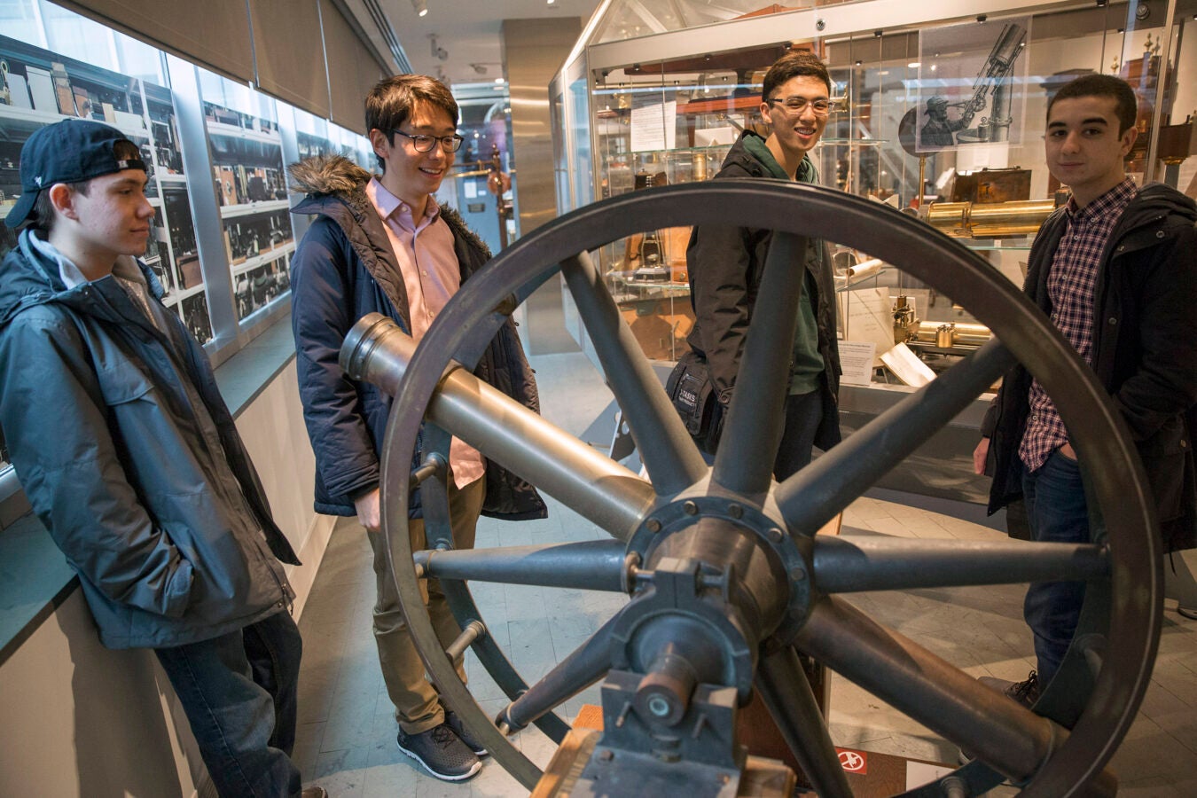 Roommates, Clifford "Scotty" Courvoisier, Kenneth Shinozuka, Sung Ahn, and Abdelrhman "Abdul" Saleh, (from far rear left to right), All class of '20 who live in Holworthy Hall, view a "Transit Circle" inside The Collection of Historical Scientific Instruments in the Science Center.
