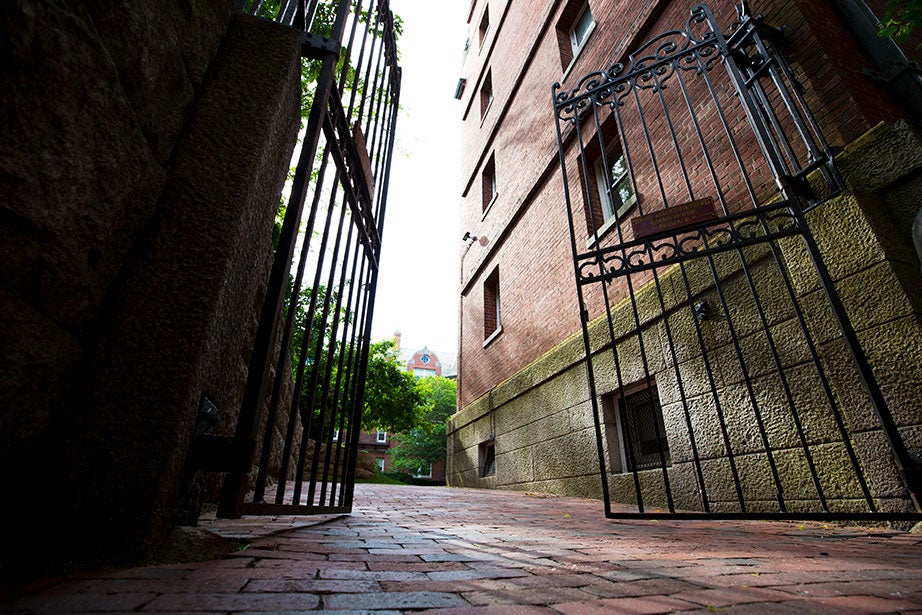 Randolph Courtyard is part of Adams House at Harvard University. Imposing black wrought-iron gates guard the entrance on Linden Street.
