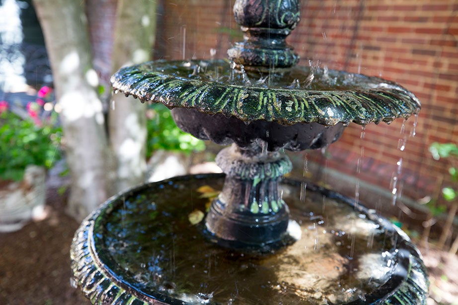 A fountain drips in a corner near the Plimpton Street entrance.