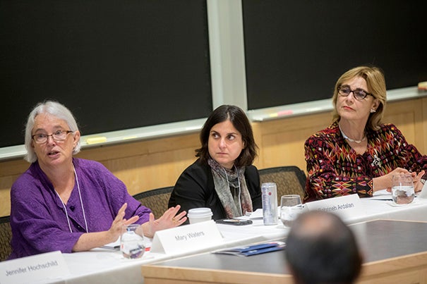 A symposium at the Harvard Global Institute examined the ethical, legal, social, cultural, and economic implications of migration. Panelists  pictured include Harvard professors Mary Waters (from left), Sabrineh Ardalan, and Jacqueline Bhabha.