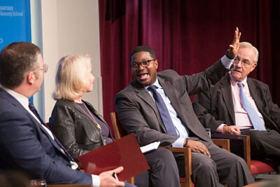 At "The Lure of the Prosperity Gospel in the Age of Trump," panelist Jonathan Walton (center)  and E.J. Dionne (right) discussed the paradoxes of the evangelical tradition and how Trump has capitalized on its appeal to both rich and poor.