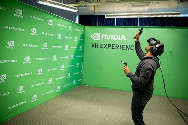 Rican Mohamed, HKS, '17 in a virtual reality space at the VR/AR Industry Fair in the i-lab during Hubweek 2015