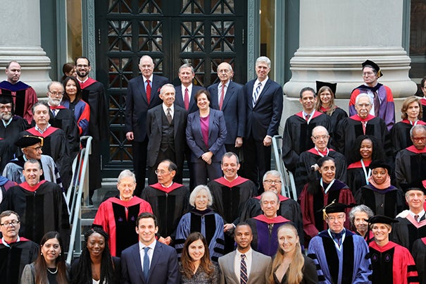 On the steps of Langdell Library, Harvard Law School faculty surround six Supreme Court justices. Back row, from left: Associate Justice Anthony M. Kennedy ’61; Chief Justice John G. Roberts Jr. ’79; Associate Justice Stephen G. Breyer ’64; and Associate Justice Neil Gorsuch ’91. Front row: Associate Justice (retired) David H. Souter ’66 and Associate Justice Elena Kagan ’86, the former dean of HLS.