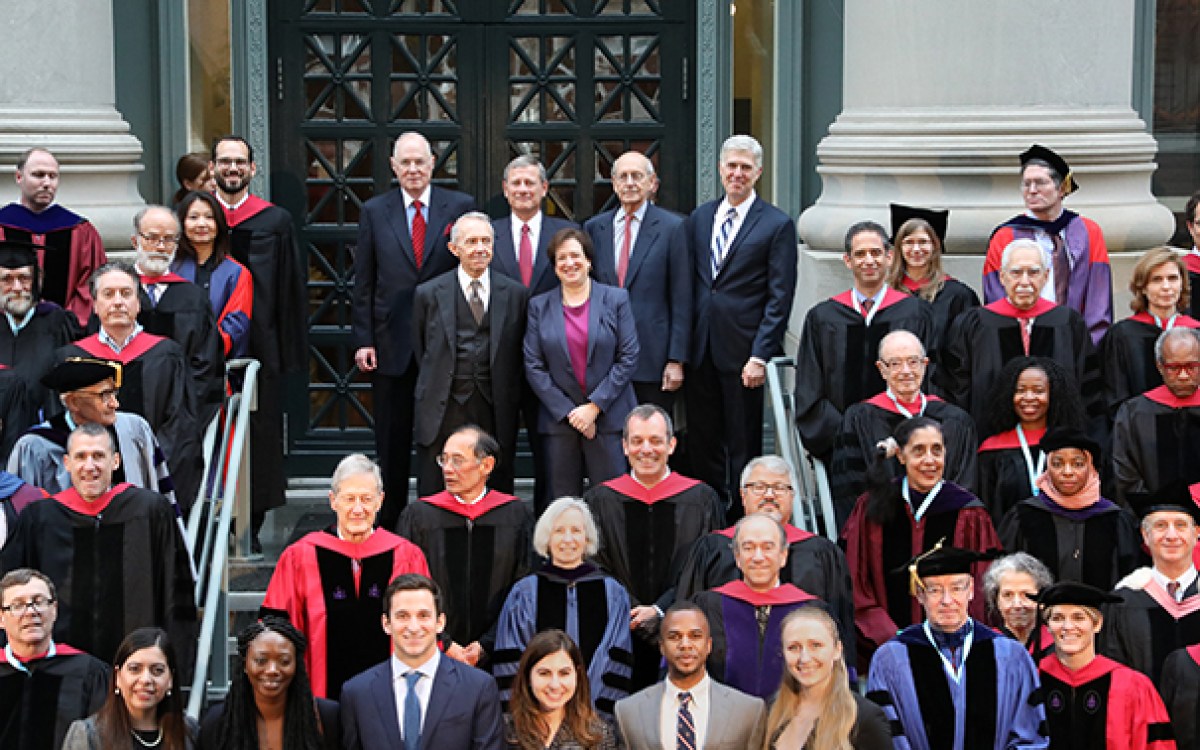 On the steps of Langdell Library, Harvard Law School faculty surround six Supreme Court justices. Back row, from left: Associate Justice Anthony M. Kennedy ’61; Chief Justice John G. Roberts Jr. ’79; Associate Justice Stephen G. Breyer ’64; and Associate Justice Neil Gorsuch ’91. Front row: Associate Justice (retired) David H. Souter ’66 and Associate Justice Elena Kagan ’86, the former dean of HLS.