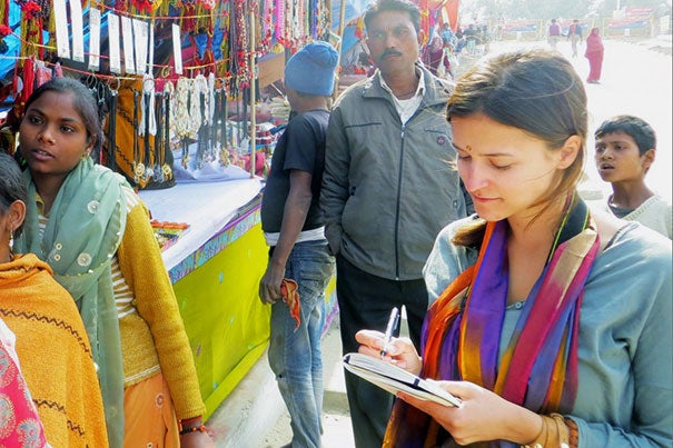 Tiona Zuzul, D.B.A. ’14, conducted field research in Allahabad, India, during Kumbh Mela in 2013. Photo by Meenah Hewett