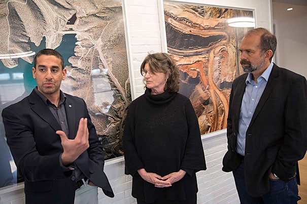 Nikhil Advani, (from left) University of Alaska, Nancy Knowlton, World Wildlife Fund, and Cam Webb talk about the best ways to understand and communicate about the environment's future inside the Harvard University Center for the Environment before the evening event at the Geo Lecture Hall.