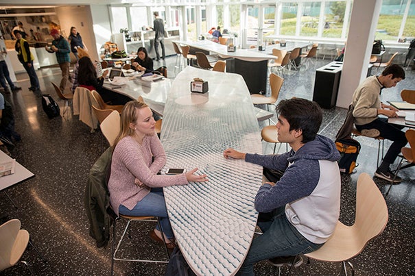 Maria McLaughlin '18 and Mauricio Ruiz '19 engage in conversation in the new Pritzker Commons. Kris Snibbe/Harvard Staff Photographer
