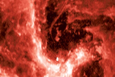 A radio image from the NSF’s Karl G. Jansky Very Large Array showing the center of our galaxy. The mysterious radio filament is the curved line located near the center of the image, and the supermassive black hole Sagittarius A* (Sgr A*) is shown by the bright, egg-shaped source near the bottom of the image.