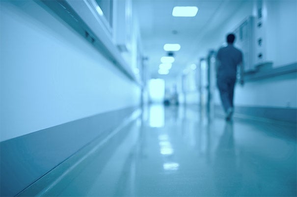 Image of doctor walking down corridor