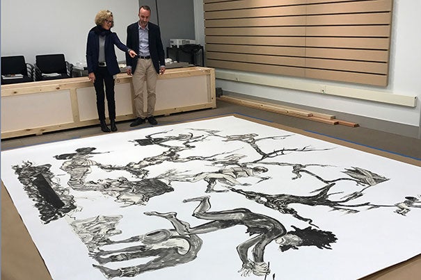Harvard Art Museums curators Mary Schneider Enriquez and Edouard Kopp view Kara Walker’s "U.S.A. Idioms" at the museums’ Somerville Research Center.
