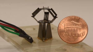 milliDelta robot next to penny