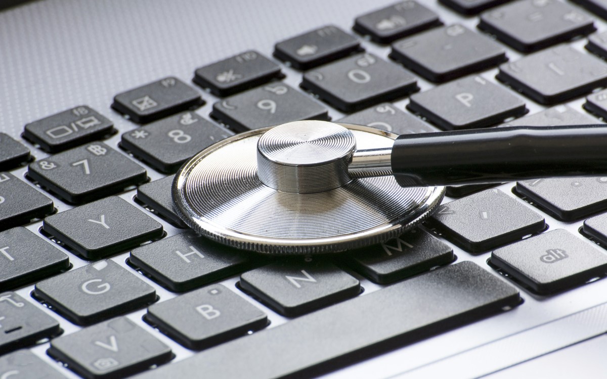 Stethoscope over a computer keyboard.