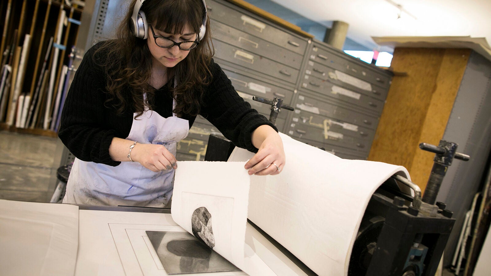 Graduate student Rachel Vogel tries her hand at printmaking.