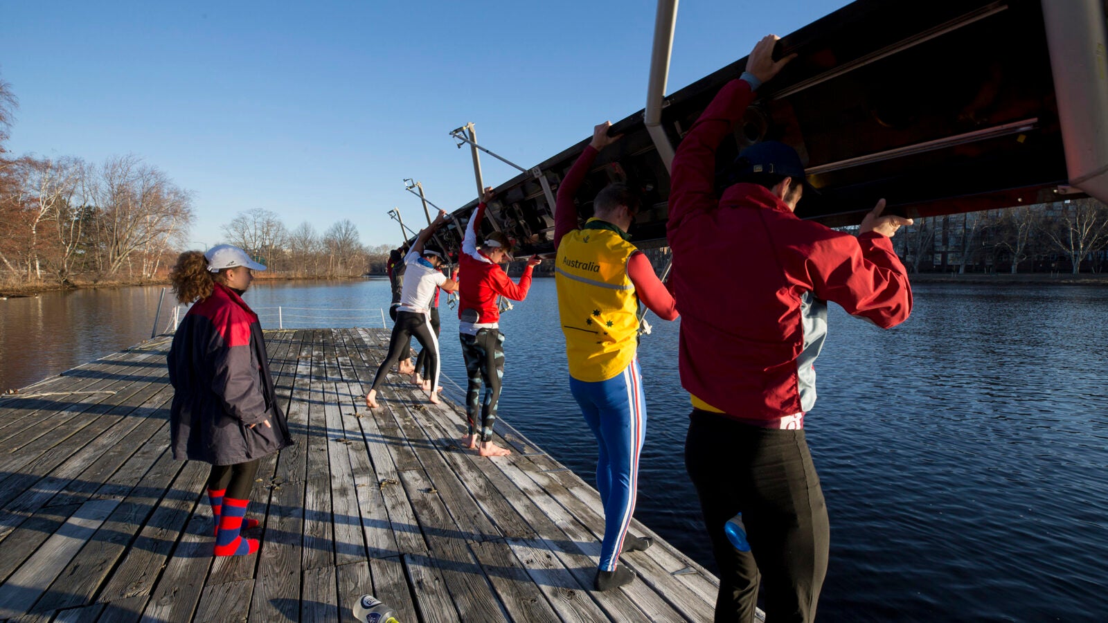 Jennie Kunes calls out instructions to her “eights” as they set their boat in the water. “One rower putting in more effort doesn’t make a measureable difference unless the entire crew does it with them, and the coxswain has to be attuned to the crew’s mentality and technique to keep everyone together.”