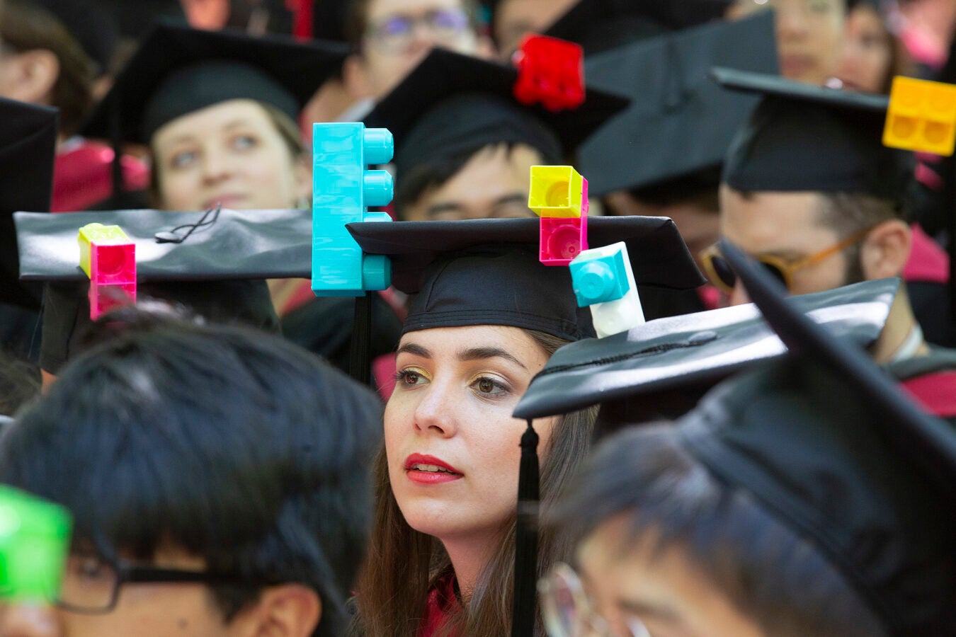 Graduate with Lego mortarboard.