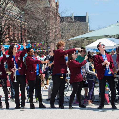 The Harvard University Band gathers on the Science Center Plaza for the opening concert.