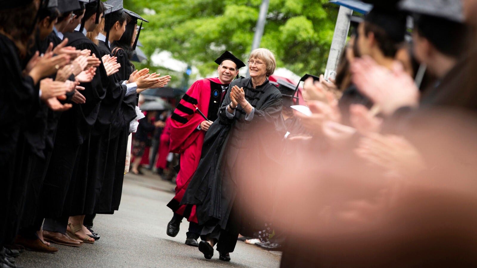 Harvard President Drew Faust (center) congratulates students outside Memorial Hall during Phi Beta Kappa Exercises. 