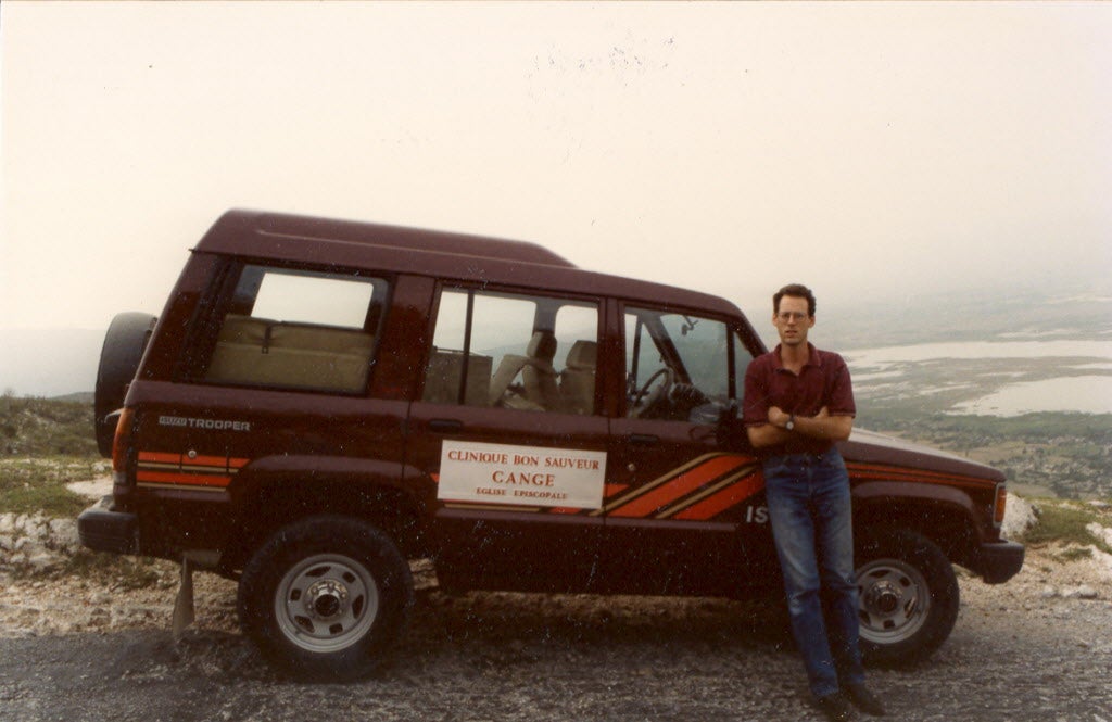 Paul Farmer in Haiti by an ambulance circa 1993.